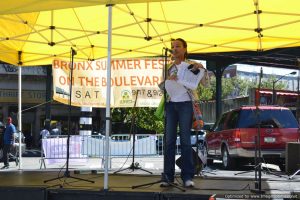 Kerry McLean, Vice President of Community Development, onstage at Bronx Summer Fest 2016.