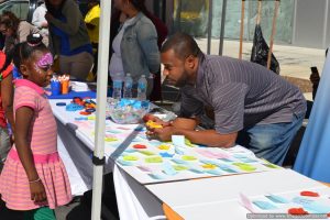 Participant organizations engage with attendees at Bronx Summer Fest 2016.