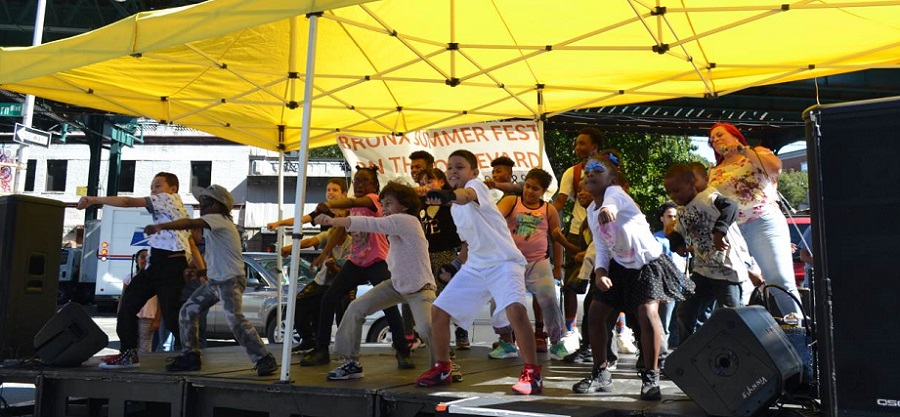 Young dancers and KR3T's delight the crowd onstage at the 2016 Bronx Summer Fest.