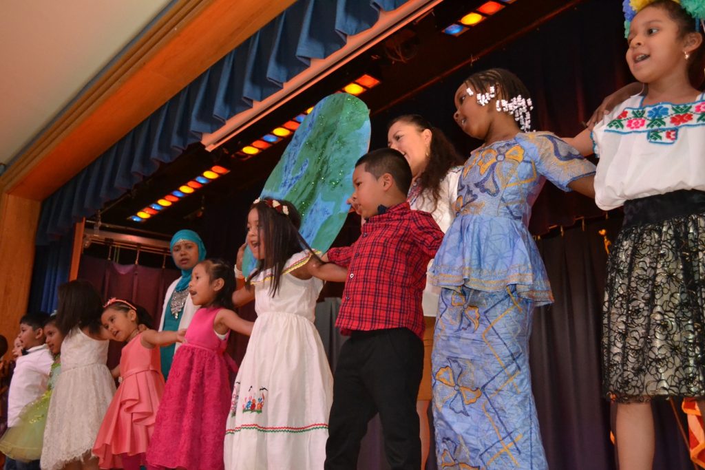 Kids onstage at moving up ceremony.